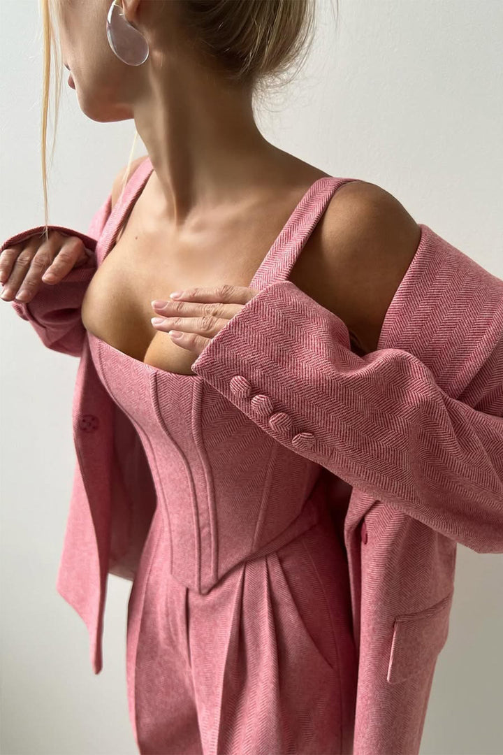 Pink off-shoulder cardigan worn by a person on a plain background